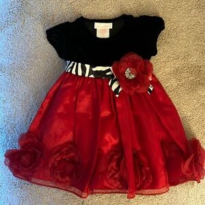 Perfect holiday dress. Black velvet top with red bottom. Black & white belt tie